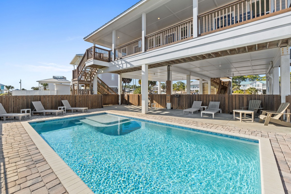 Dive into your private oasis with crystal-clear waters surrounded by comfortable lounge chairs and tropical breezes.