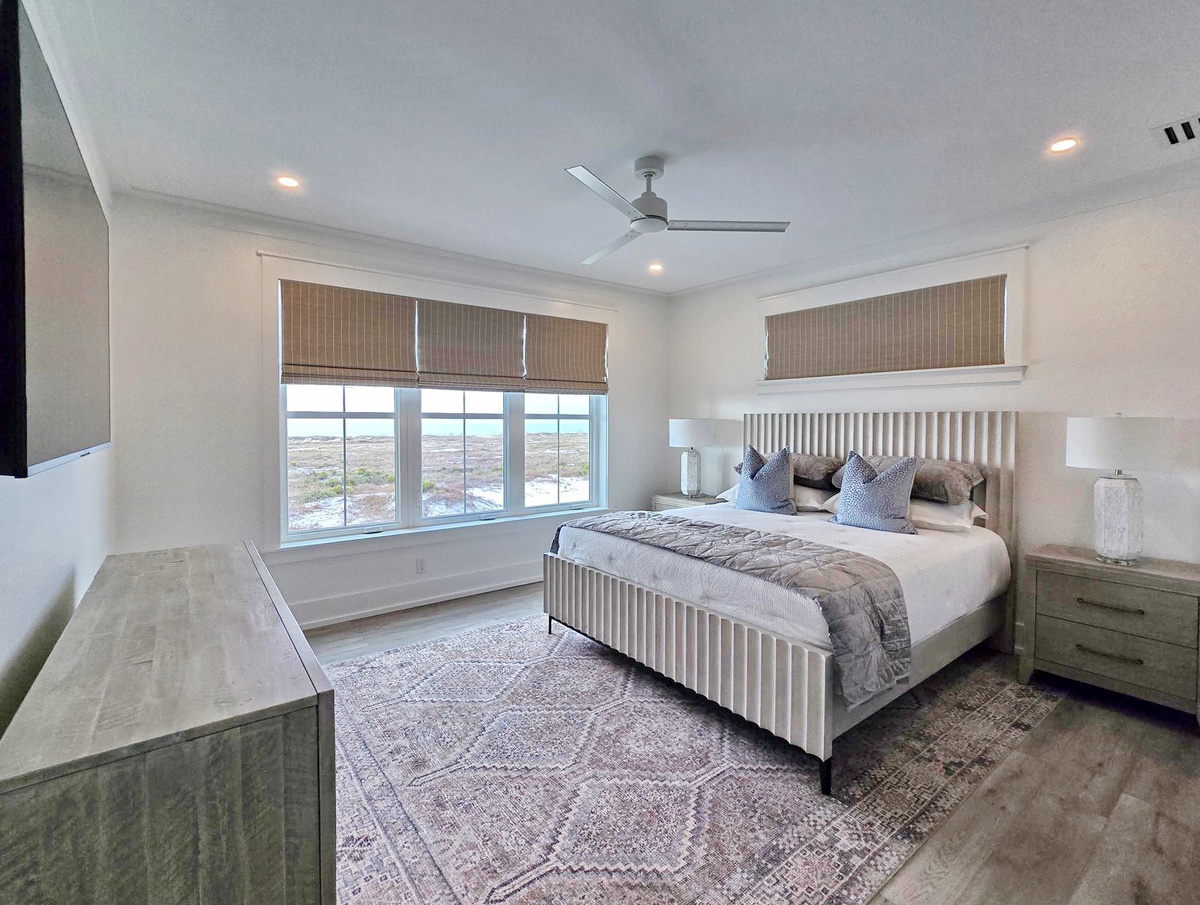 Drift off peacefully in your serene bedroom sanctuary, where panoramic views and elegant furnishings create the perfect retreat for restful nights.