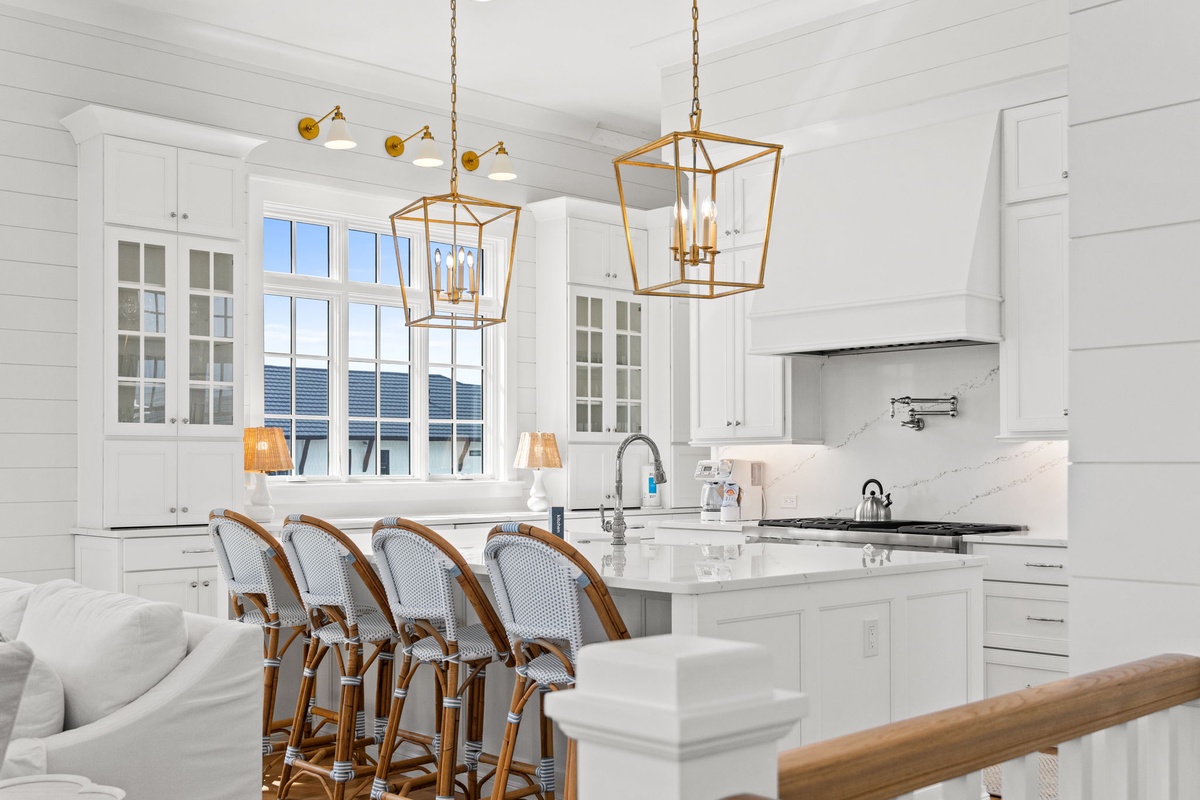 Picture yourself preparing meals in this bright, open kitchen with elegant finishes and a spacious island—perfect for gathering with loved ones over coffee or a glass of wine.
