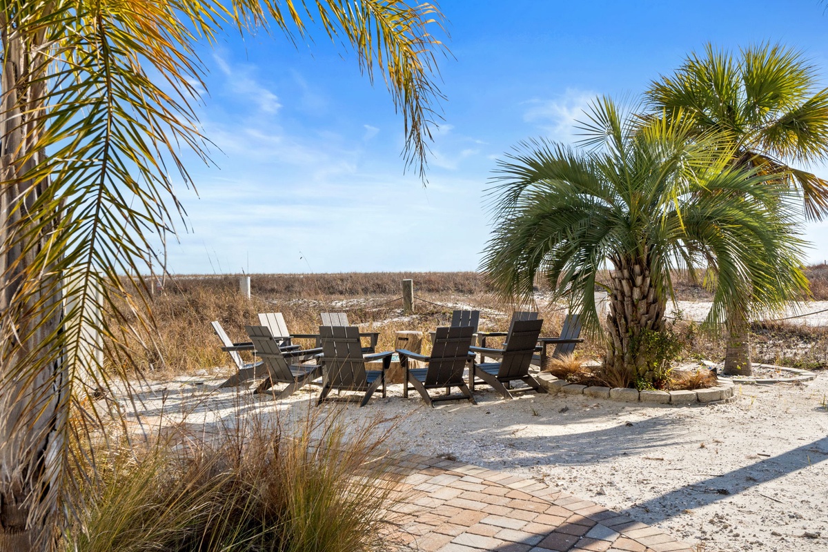 Relax in your private beachside seating area, surrounded by swaying palms and soft sand beneath your feet.