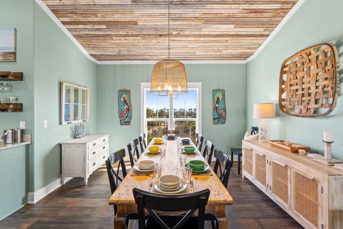 Gather around this stunning farmhouse dining table where your family meals become cherished memories under warm wicker lighting.