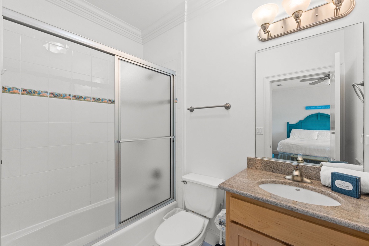 Your bright, spotless bathroom features a walk-in shower, modern vanity with granite countertop, and everything you need to feel refreshed after a day of adventure.