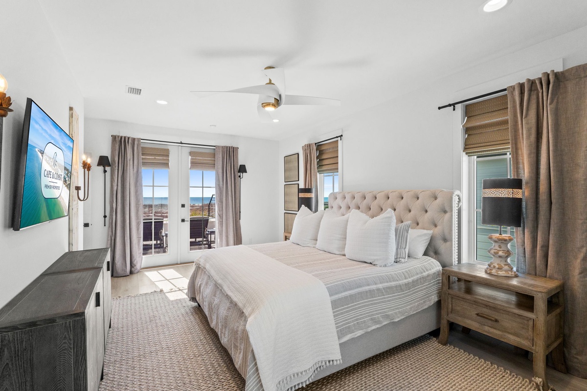 Drift off to sleep in your plush tufted bed while ocean breezes flow through French doors leading to your private balcony.
