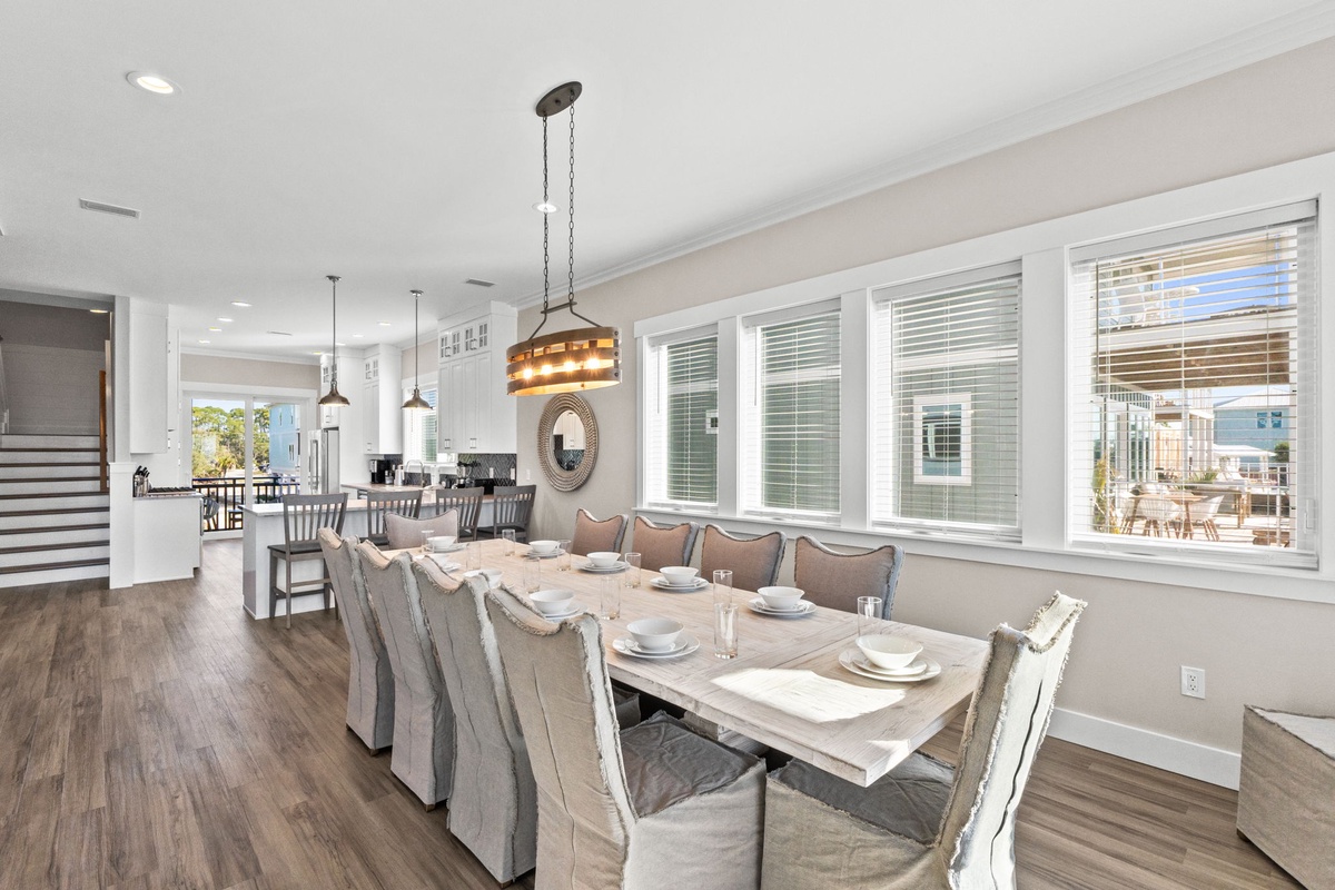 Gather around this elegant dining table for memorable meals with loved ones in your beautifully appointed open-concept space.