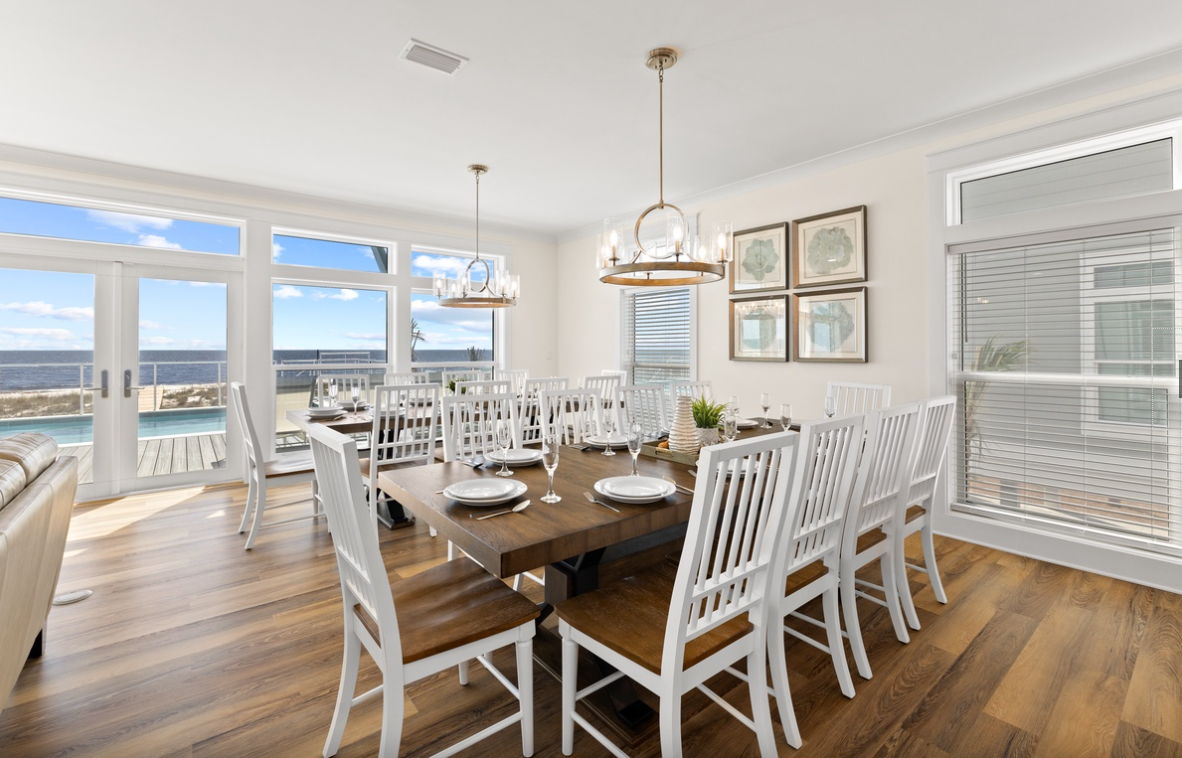 Gather around this elegant dining table where ocean views create the perfect backdrop for your memorable meals together.