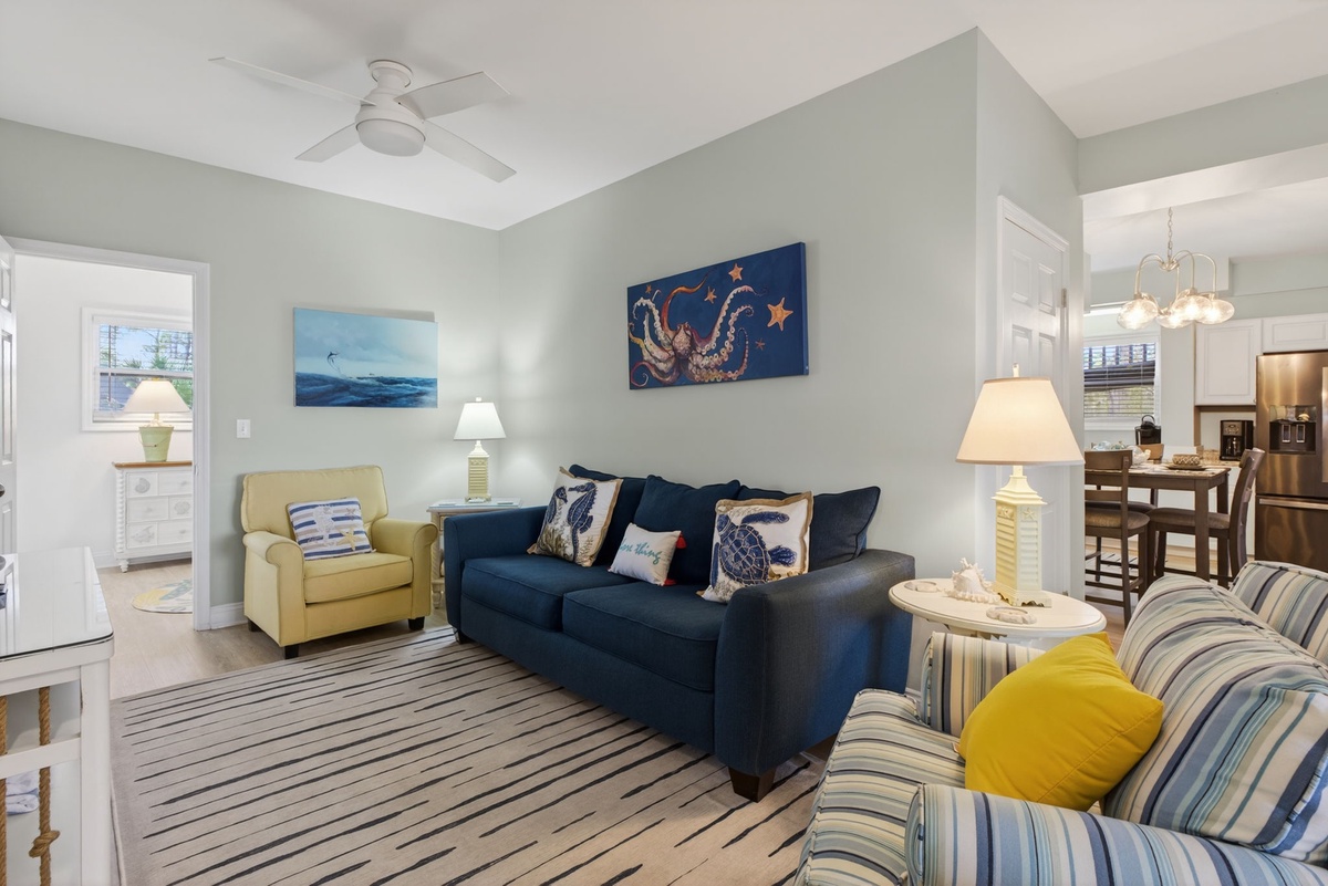 Sink into coastal comfort in your stylish living room, where nautical artwork and ocean-inspired decor create the perfect seaside retreat.