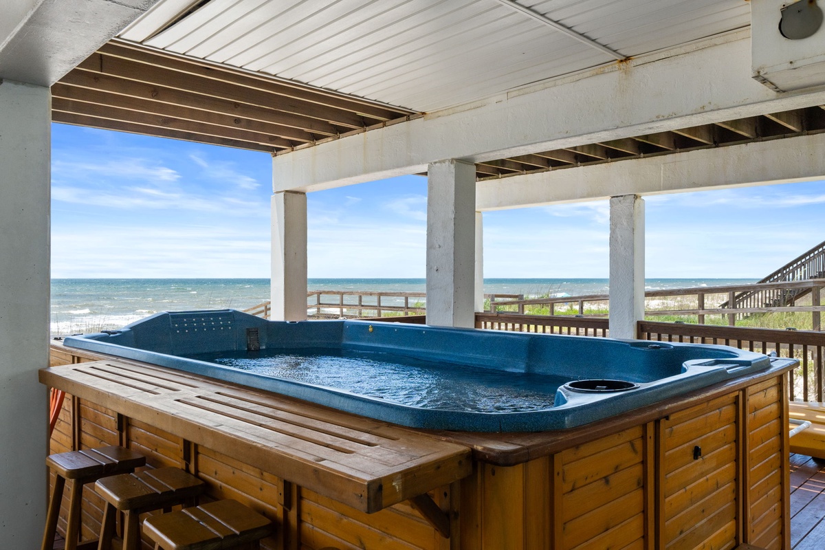 Soak in the hot tub while taking in sweeping ocean views just steps from the sand—your perfect coastal retreat awaits.