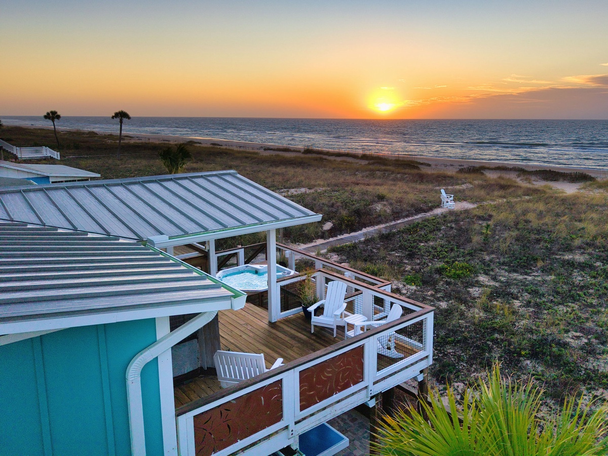 Beachfront property offers stunning ocean views and direct beach access with sunrise vistas over the water.