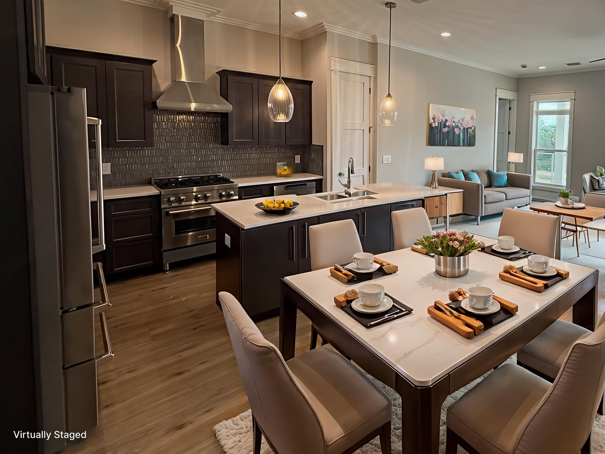 Your open-concept kitchen flows seamlessly into the dining area, featuring modern appliances and elegant pendant lighting for memorable meals together.