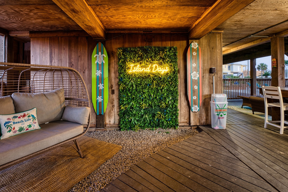 Relax in your private beach-themed sanctuary with cozy seating, vibrant surfboard decor, and tropical touches that make every moment feel like vacation.