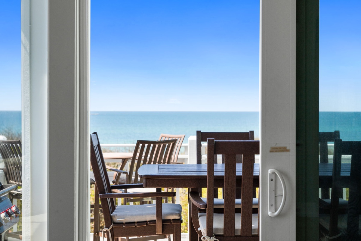 Step onto your private balcony where ocean breezes meet comfortable dining furniture, perfect for morning coffee with stunning sea views.