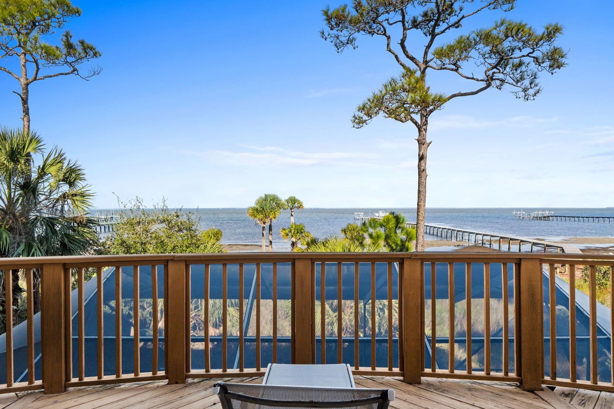 Unwind on your private deck with stunning waterfront views, swaying palms, and gentle ocean breezes creating the perfect coastal retreat.
