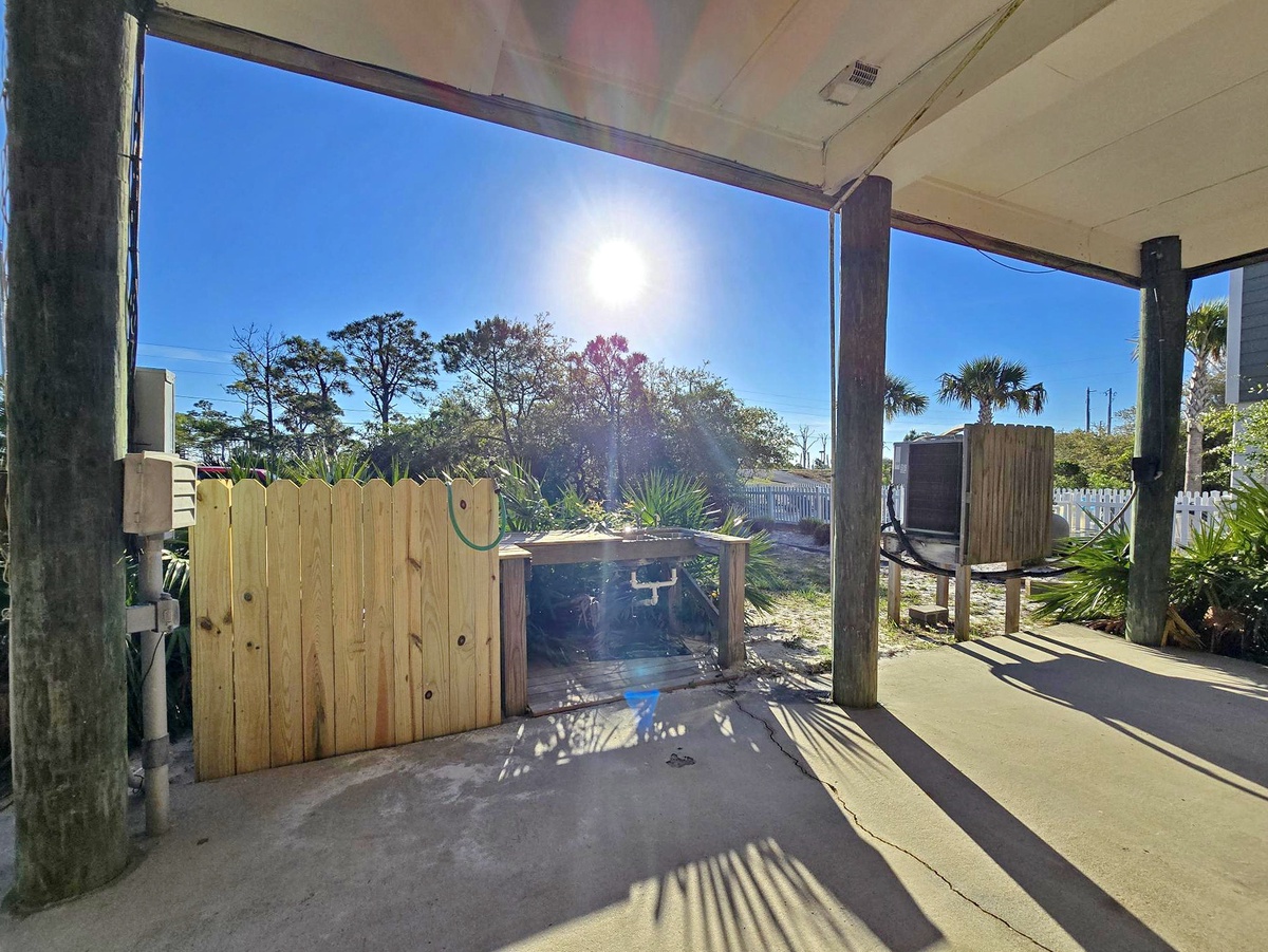 Step onto your private covered patio where tropical breezes and sunshine create the perfect outdoor retreat for morning coffee or evening relaxation.