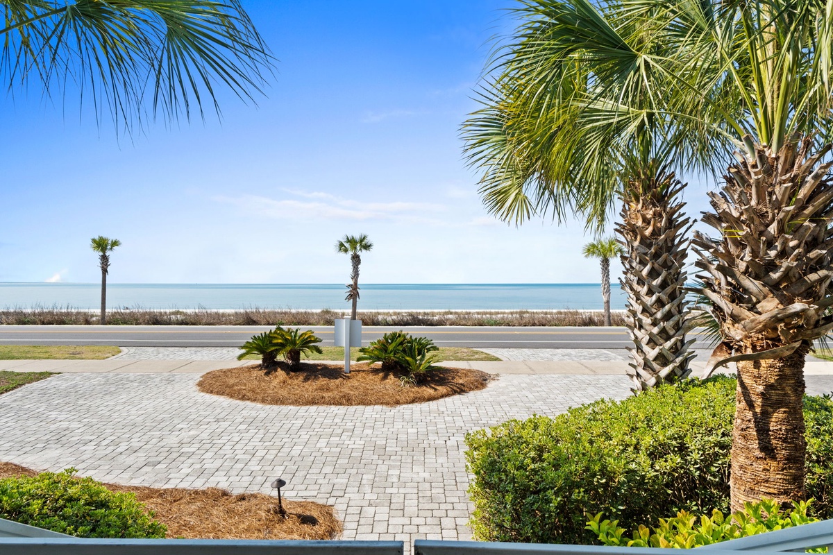 Tropical paradise awaits with stunning beachfront location featuring swaying palms, pristine sands, and endless ocean views just steps away.