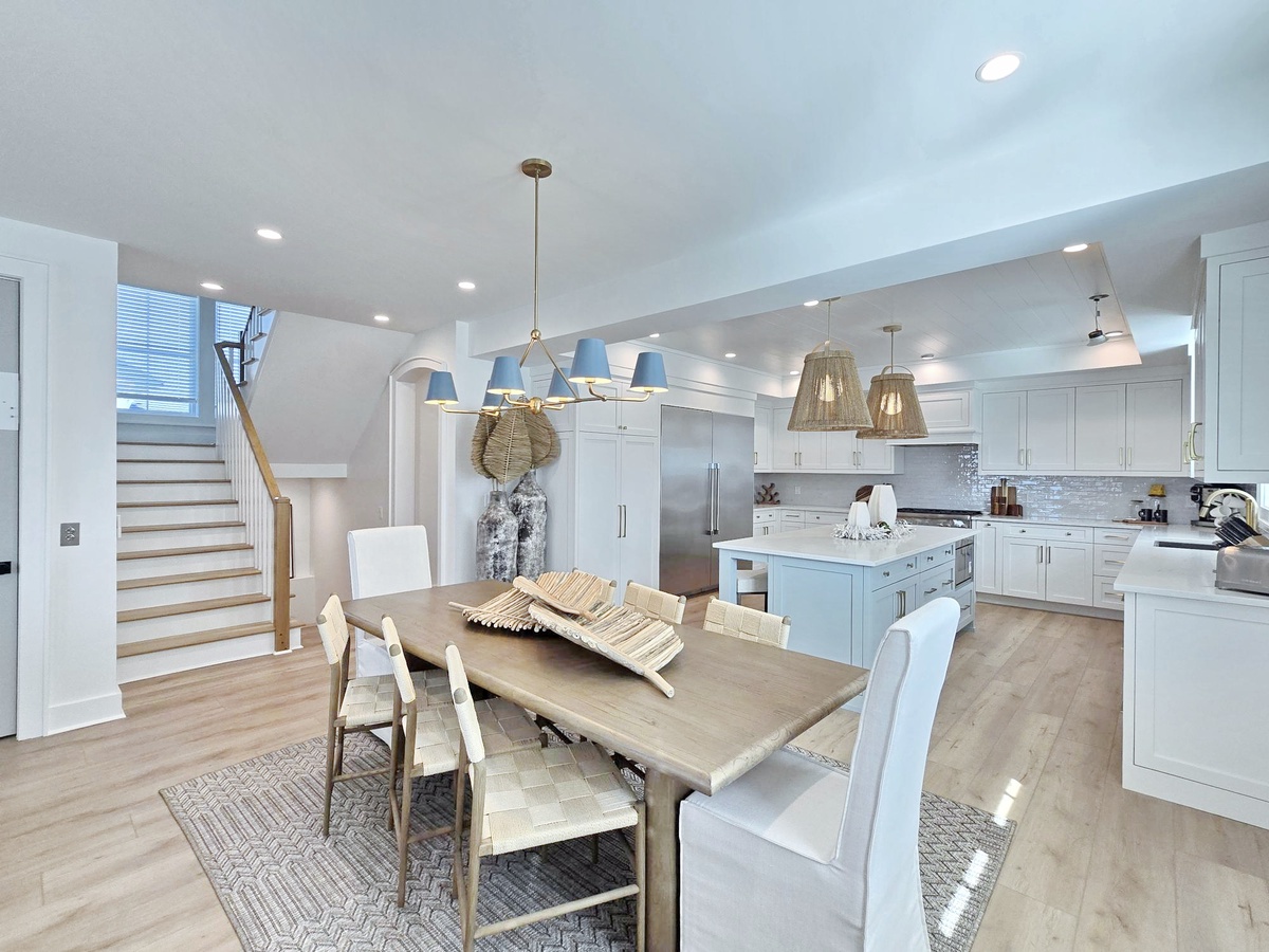 Your gourmet kitchen flows seamlessly into the dining space, creating the perfect setting for memorable meals together.