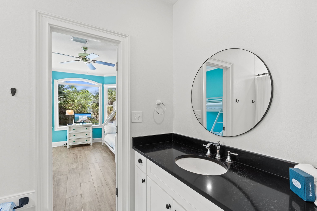 Refresh in your elegant bathroom with gleaming granite countertops and modern fixtures, connecting to your bright bedroom sanctuary.