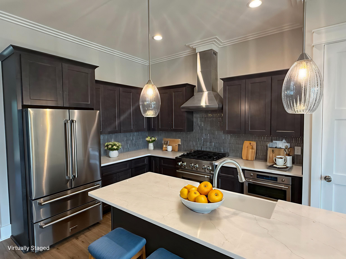 Your modern kitchen awaits with gleaming quartz countertops, stainless steel appliances, and elegant pendant lighting—perfect for culinary adventures.