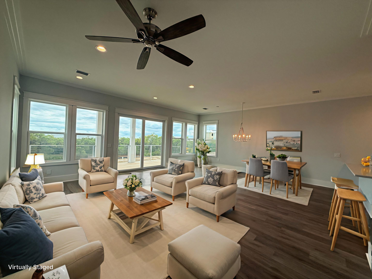 Relax in your bright open living space with panoramic windows and modern comfort. The ceiling fan keeps you cool while you enjoy natural light.