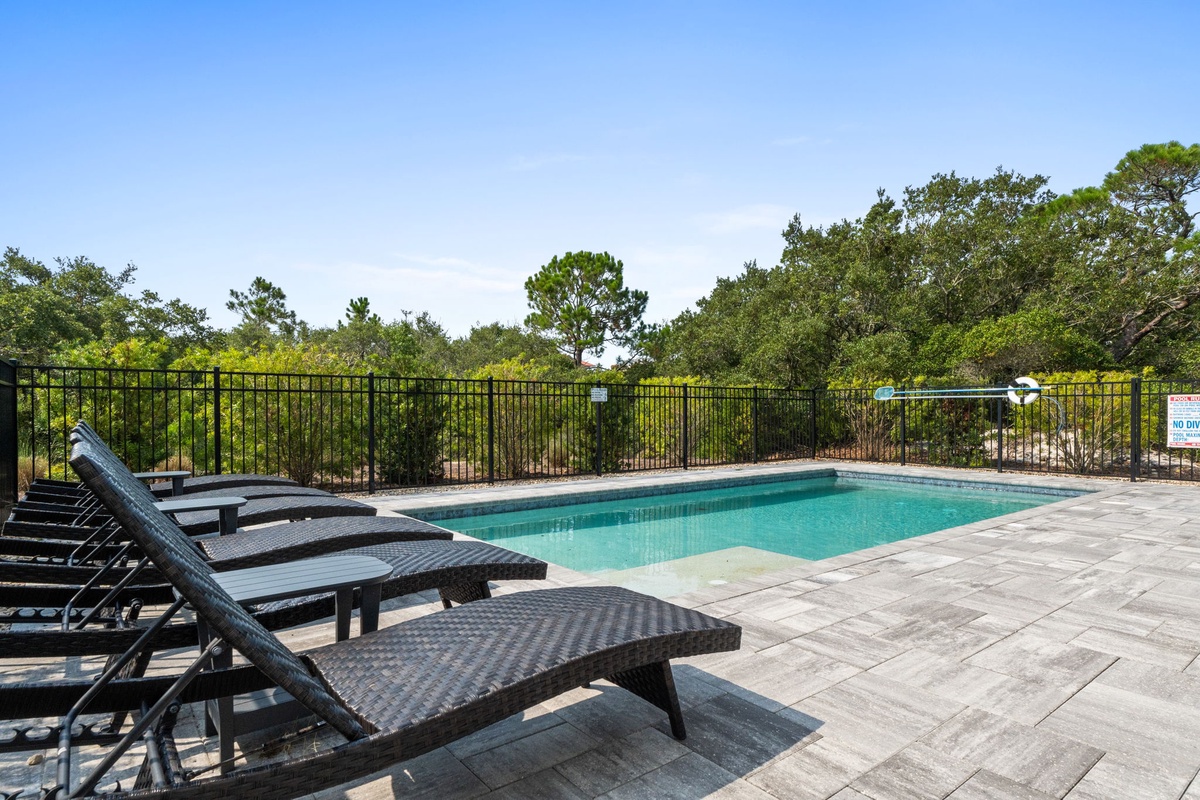 Picture yourself unwinding by the sparkling pool, lounging on a cushioned sunbed with nothing but lush greenery and open skies surrounding you. Perfect for those warm, carefree days.
