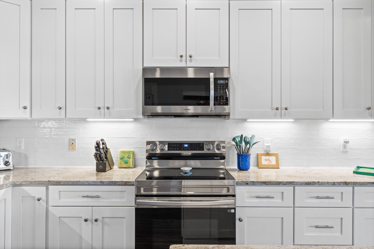 Your bright kitchen features stainless steel appliances and ample counter space for preparing memorable meals during your stay.