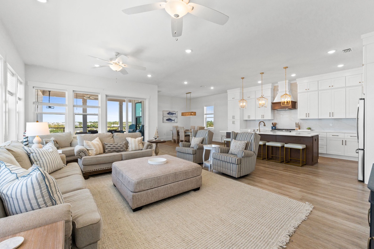 Unwind in your open-concept haven where coastal elegance meets modern comfort, featuring a gourmet kitchen and panoramic views.