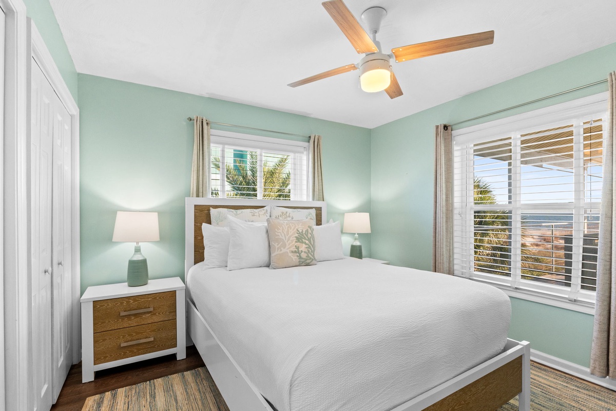 Drift into peaceful sleep in your serene coastal bedroom, where soft mint walls and crisp linens create your perfect retreat.