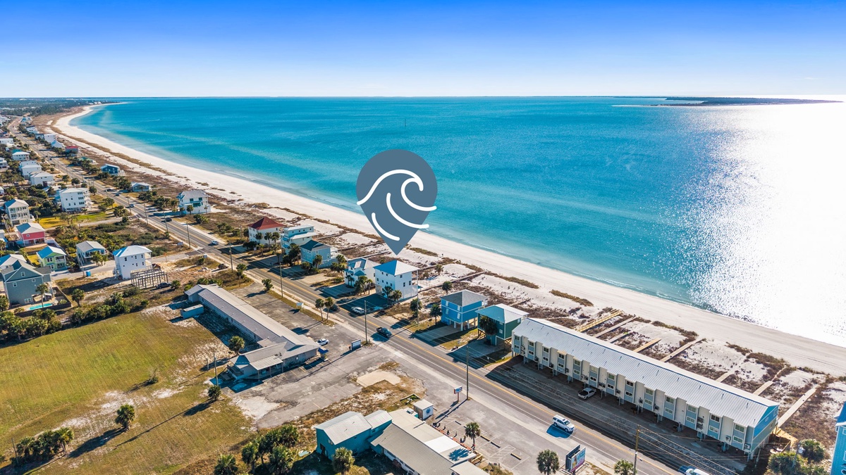 Stunning beachfront properties line pristine white sand shores and turquoise waters in this coastal paradise.