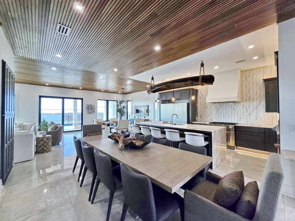 You'll love gathering around this stunning dining table, seamlessly connected to your gourmet kitchen for effortless entertaining.