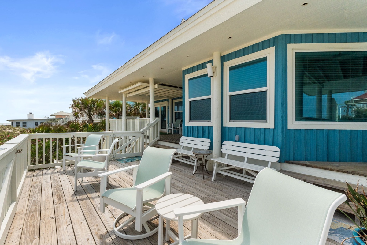 Settle into your spacious deck, where coastal breezes and swaying palms frame your oceanside escape. This sun-soaked retreat invites you to unwind with morning coffee or sunset cocktails.