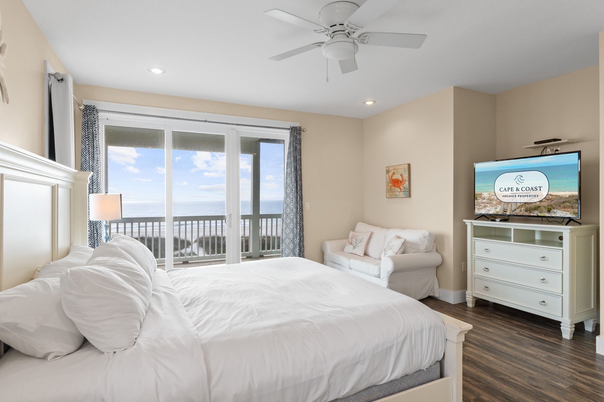 Wake up to stunning ocean views through your private balcony doors, where soft linens and coastal breezes create your perfect seaside retreat.