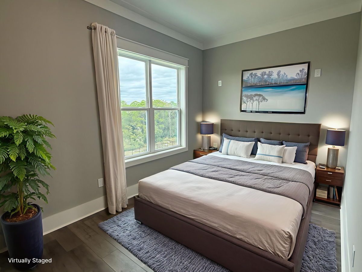 Your peaceful bedroom features plush bedding and natural light streaming through large windows for restful nights.