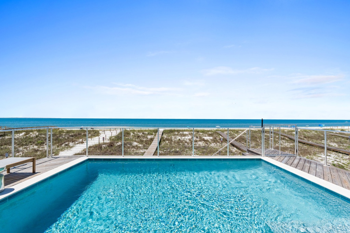 Private pool with direct beach access and stunning turquoise waters—your perfect coastal escape awaits just steps from pristine white sands.