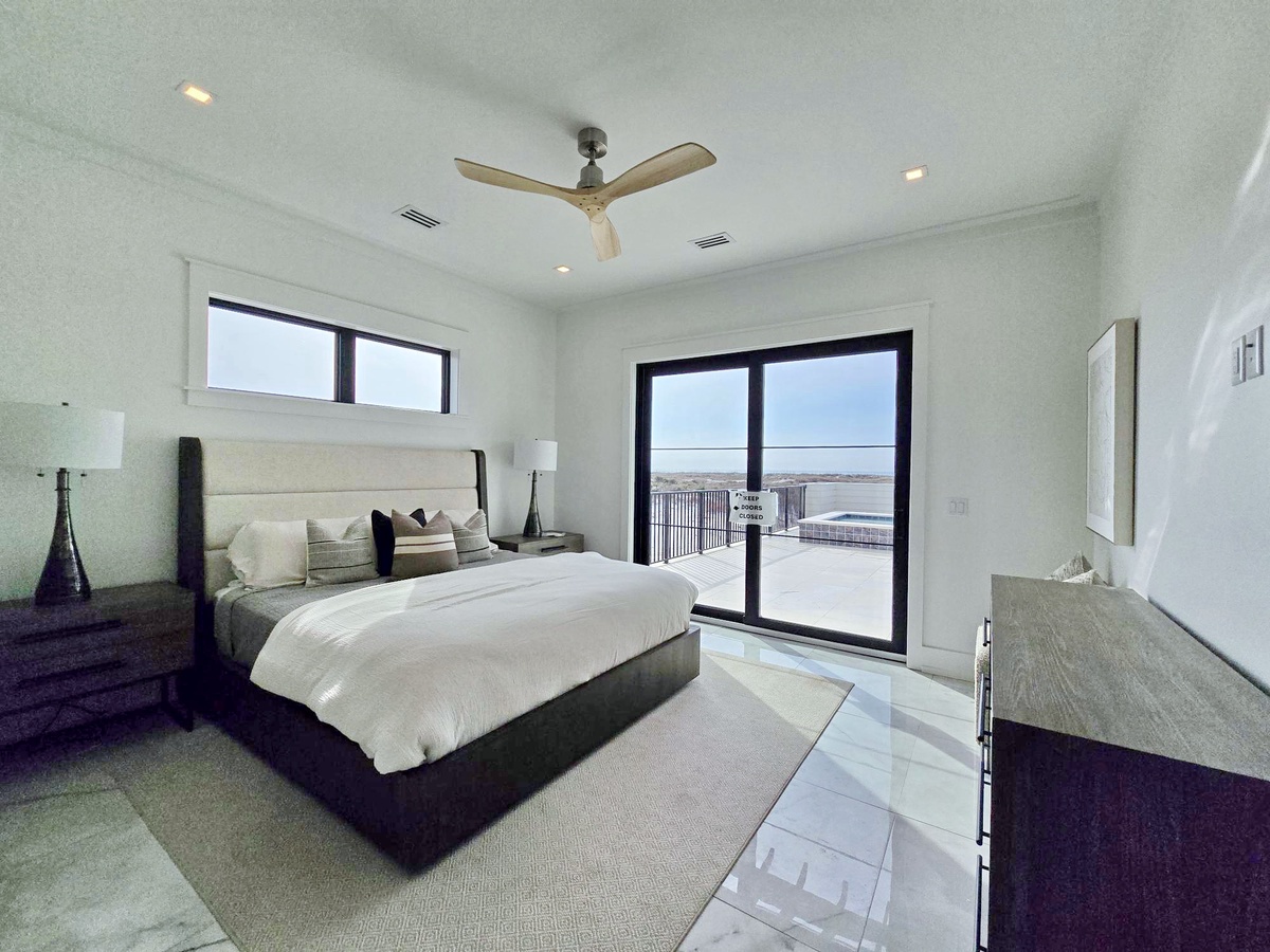 Rest peacefully in your modern bedroom with plush linens and private balcony access for morning coffee or sunset views.