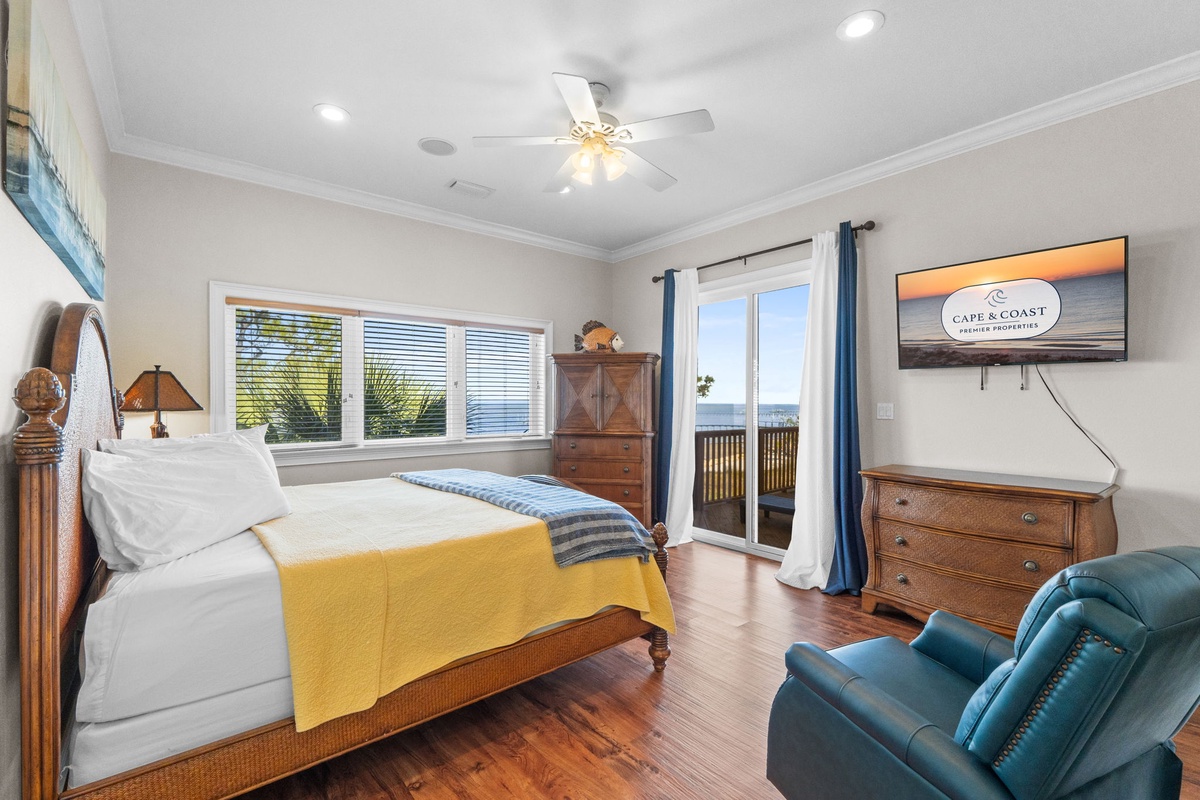 Wake up to stunning ocean views from your private bedroom retreat, complete with balcony access and coastal charm.