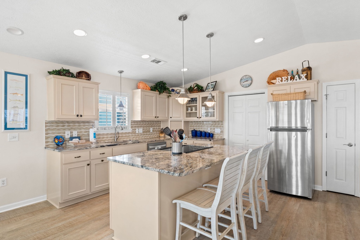 Your gourmet kitchen awaits with granite countertops, stainless appliances, and island seating for memorable meals together.