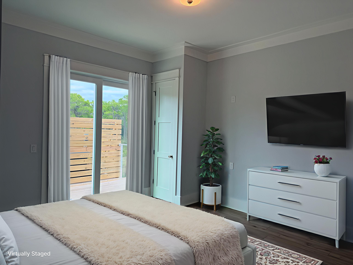 Relax in your stylish bedroom with clean lines, natural light streaming through French doors, and modern amenities for peaceful evenings.