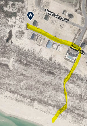 Aerial view showing the property's coastal location to beach access via community boardwalk.