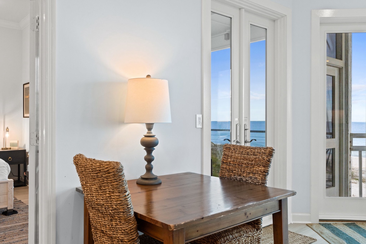 Enjoy meals at your own dining table while gazing out at stunning sea views through floor-to-ceiling windows.
