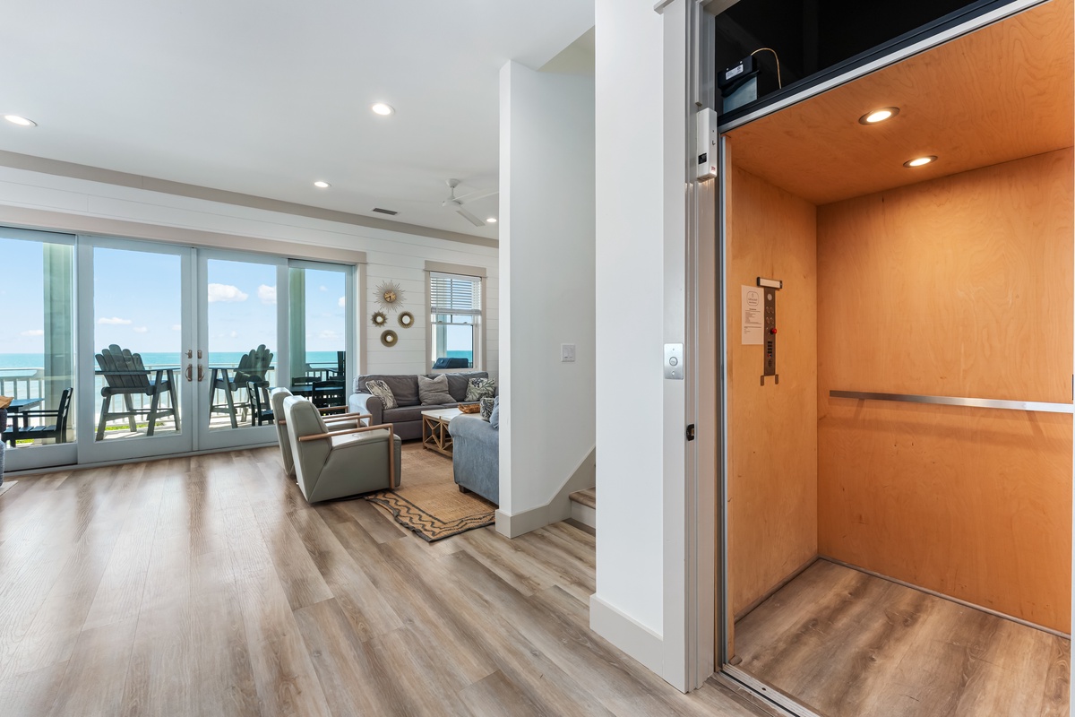 Step into your coastal retreat with modern comforts and stunning ocean views from your spacious living room.