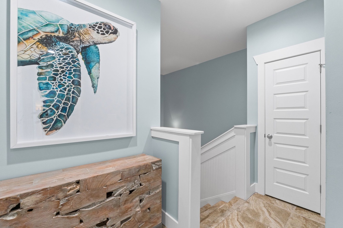 Coastal charm meets your comfort with sea turtle artwork and soft blue tones welcoming you home each day.