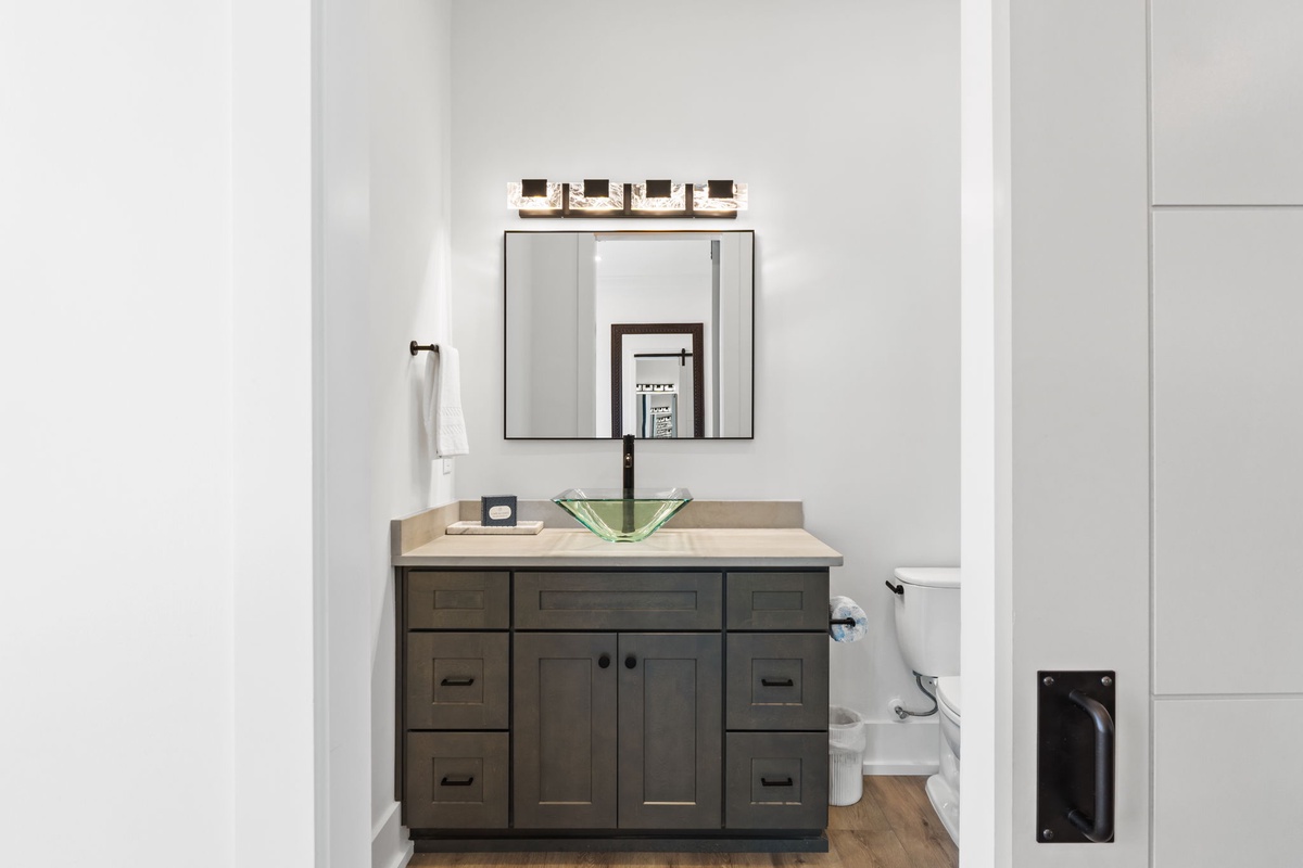 Your private bathroom features modern finishes, ample storage, and stylish lighting for comfort during your stay.