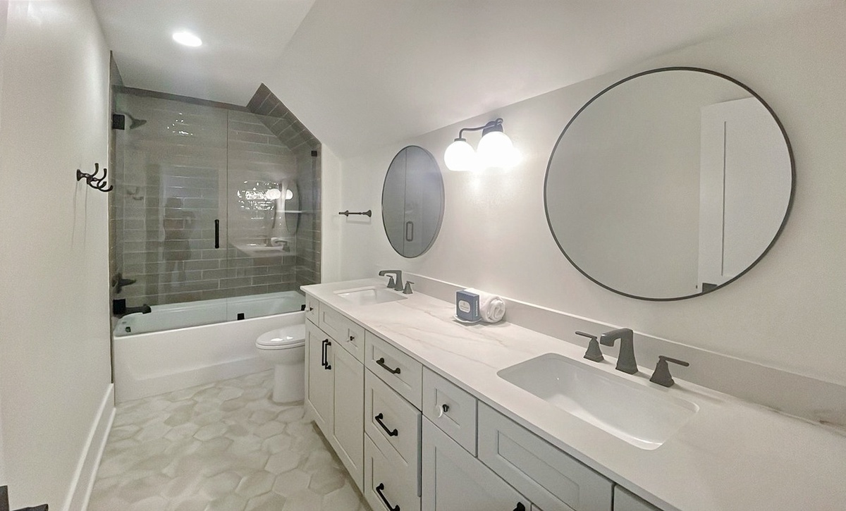 Unwind in your beautifully appointed bathroom with modern finishes, a luxurious soaking tub, spacious dual vanity, and elegant walk-in shower—designed for your relaxation and comfort.