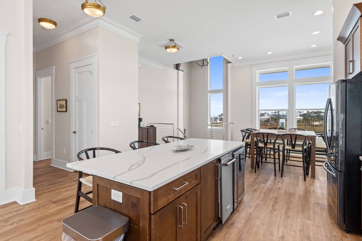 Your gourmet kitchen awaits with marble countertops, premium appliances, and sweeping views for memorable meal preparation.