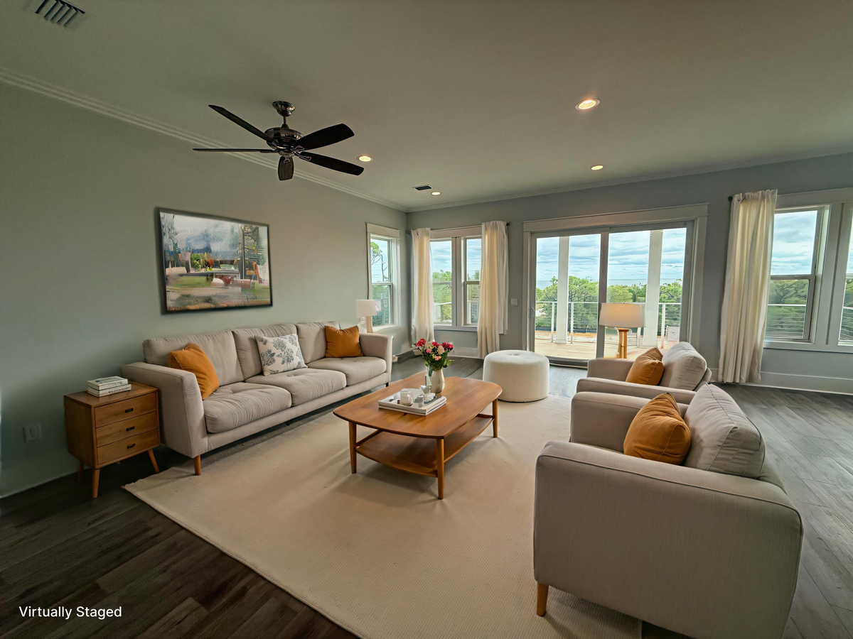 Unwind in your bright living space where floor-to-ceiling windows frame stunning views and comfortable seating invites relaxation.