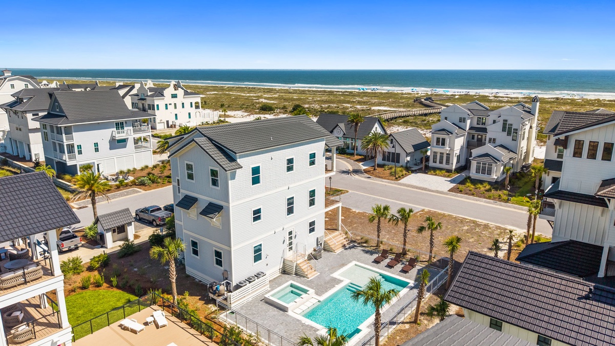 This beachfront community offers direct access to pristine shores and stunning coastal living. The property's private pool and hot tub are perfect for relaxing after a day in the sun.