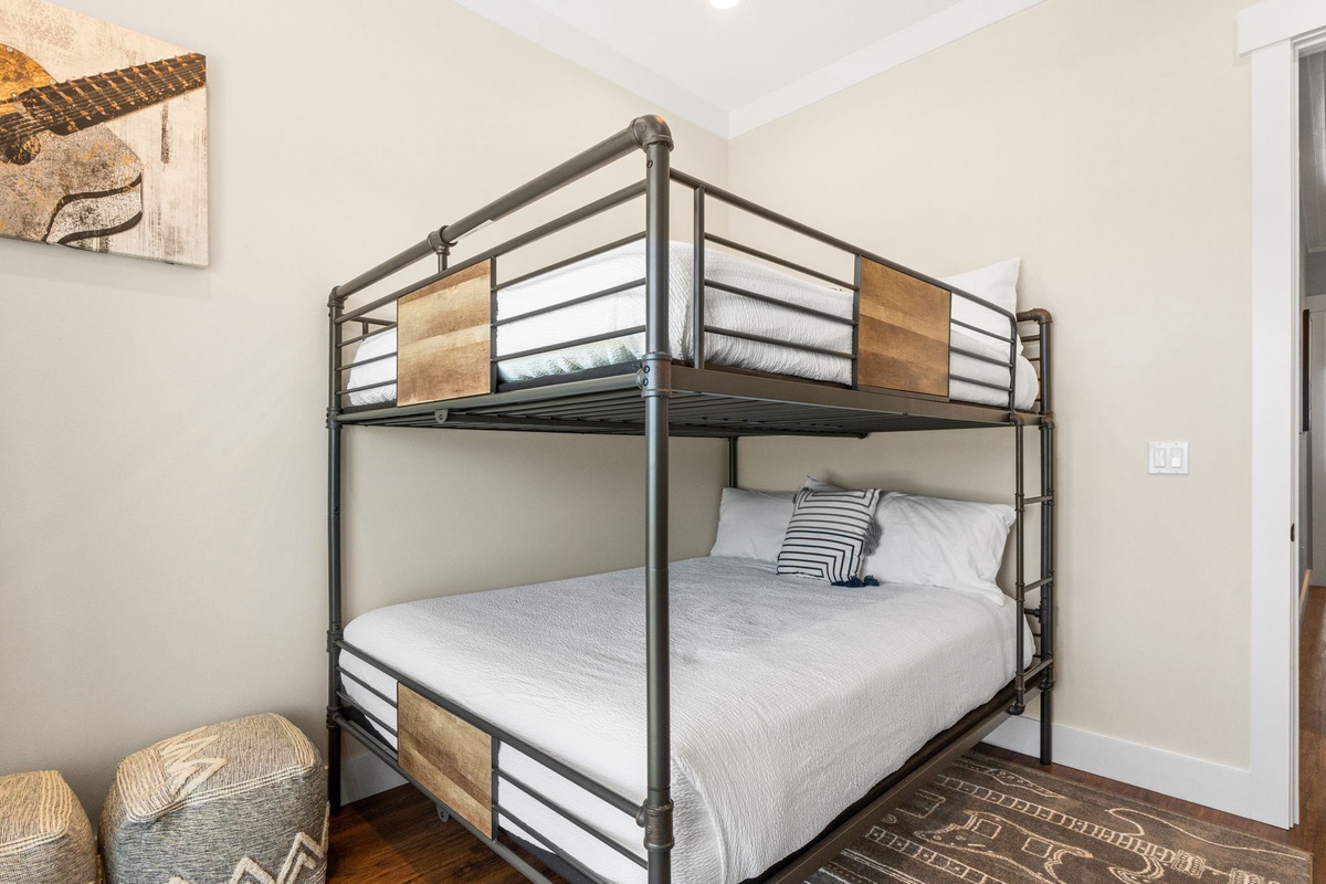 Your stylish bunk bed sanctuary blends modern metal design with warm wood accents for comfortable dreams.
