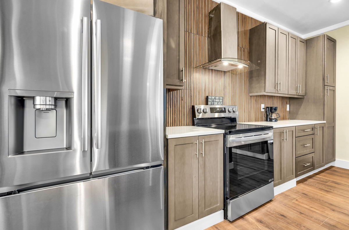 Your gourmet kitchen features stainless steel appliances, elegant cabinetry, and modern finishes for effortless meal preparation.