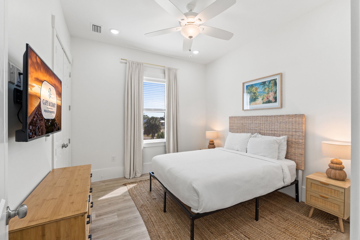 Relax in your serene bedroom with crisp white linens, natural wicker touches, and warm lighting that creates the perfect retreat.
