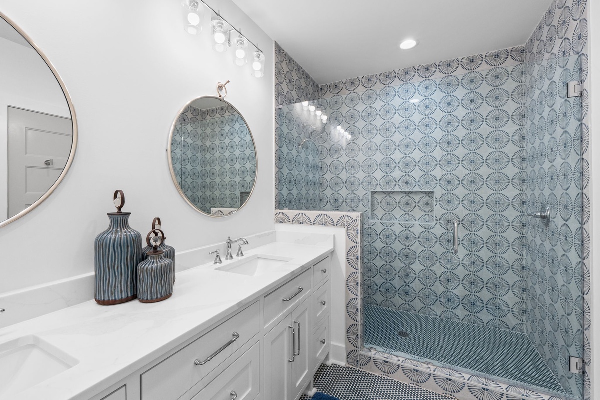 Indulge in your private spa retreat with stunning geometric tile work and luxurious finishes that transform your daily routine.