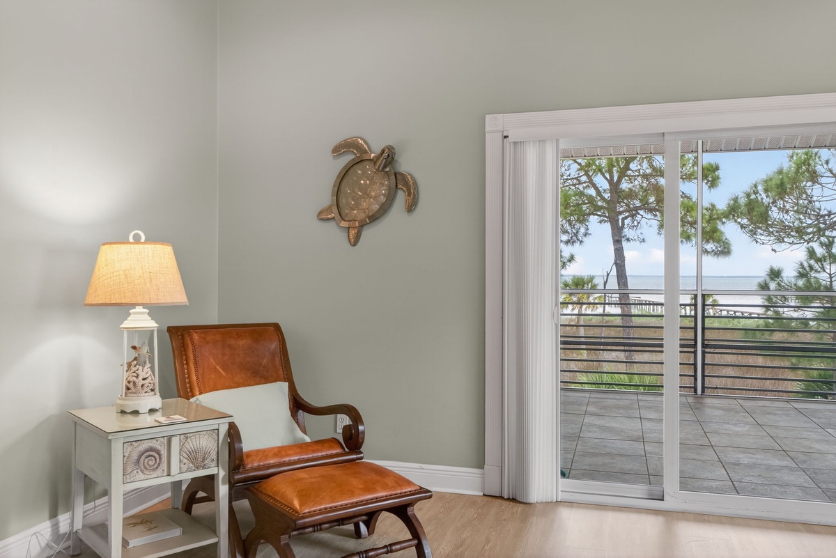Sink into your leather reading chair and enjoy ocean views through sliding glass doors that open to your private terrace.